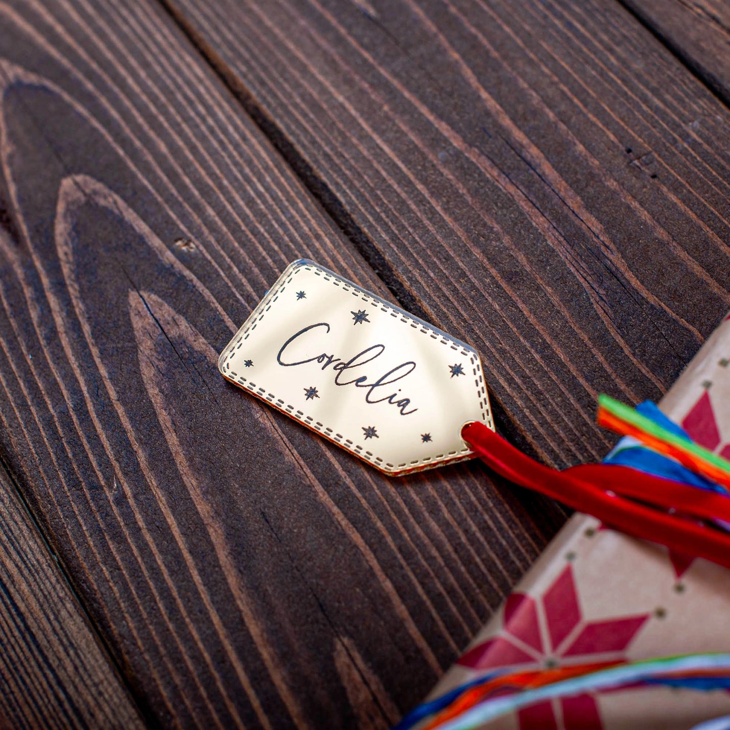 Engraved gold mirror star design Christmas name tag