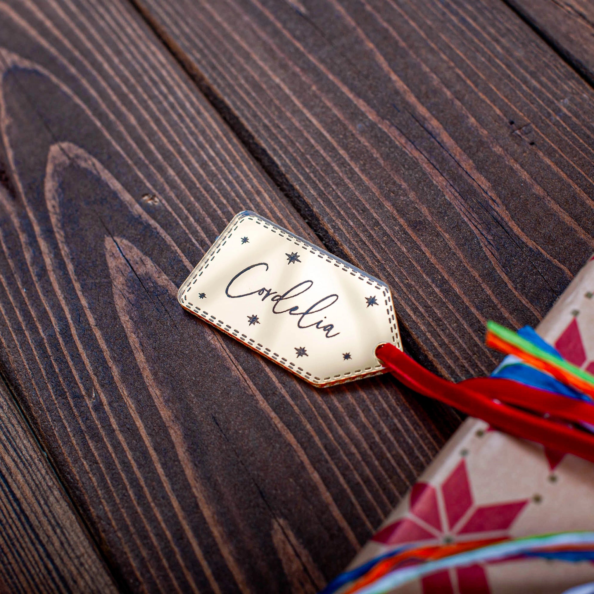 Engraved gold mirror star design Christmas name tag