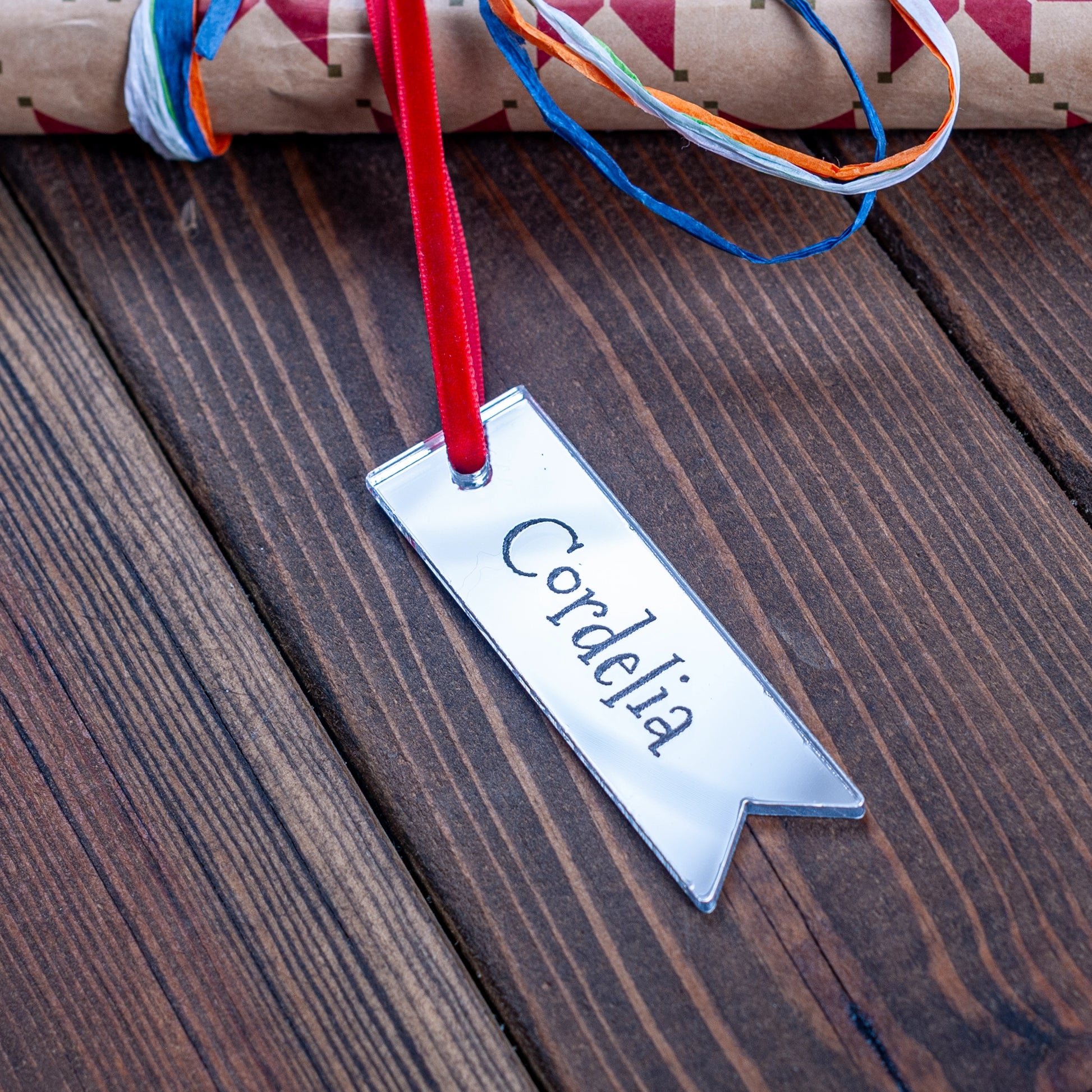 Personalised silver mirror Christmas gift tag engraved with name, festive wrapping accessory