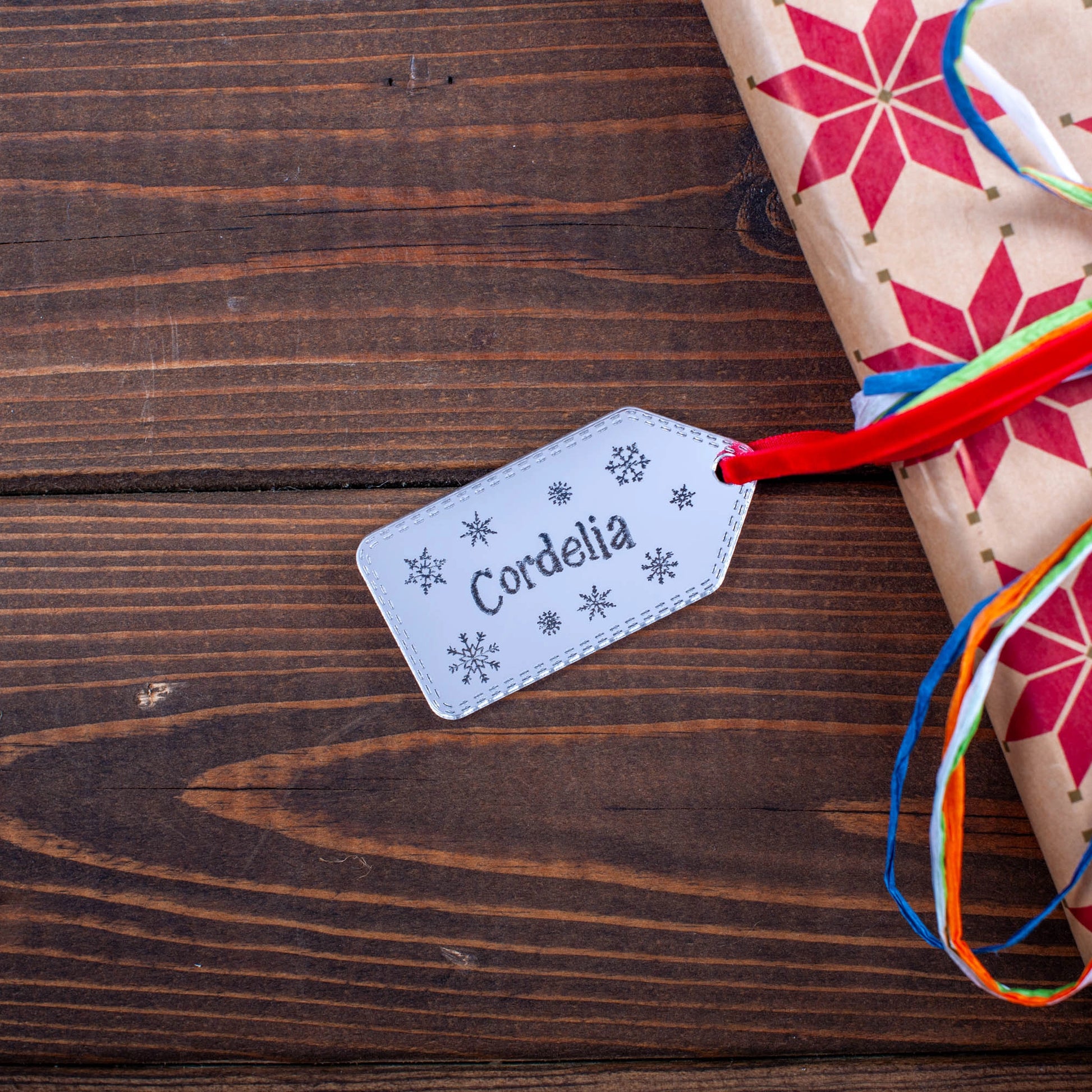 Reflective silver snowflake gift tag with personalised engraving