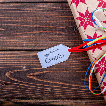 Luxury silver mirror tag engraved with Santa design on gift box
