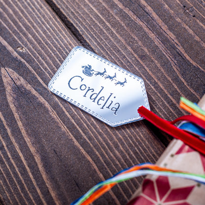 Silver mirror Christmas gift tag engraved with Santa and sleigh