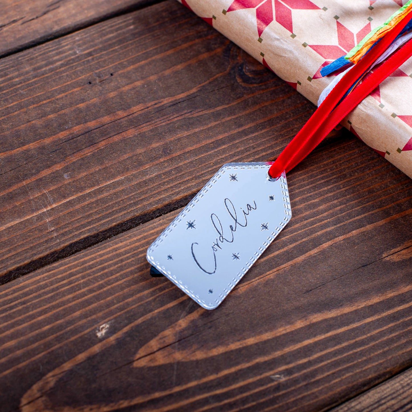 Personalised silver mirror acrylic tag with star engraving
