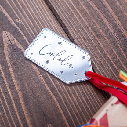 Silver mirror Christmas gift tag engraved with stars and name