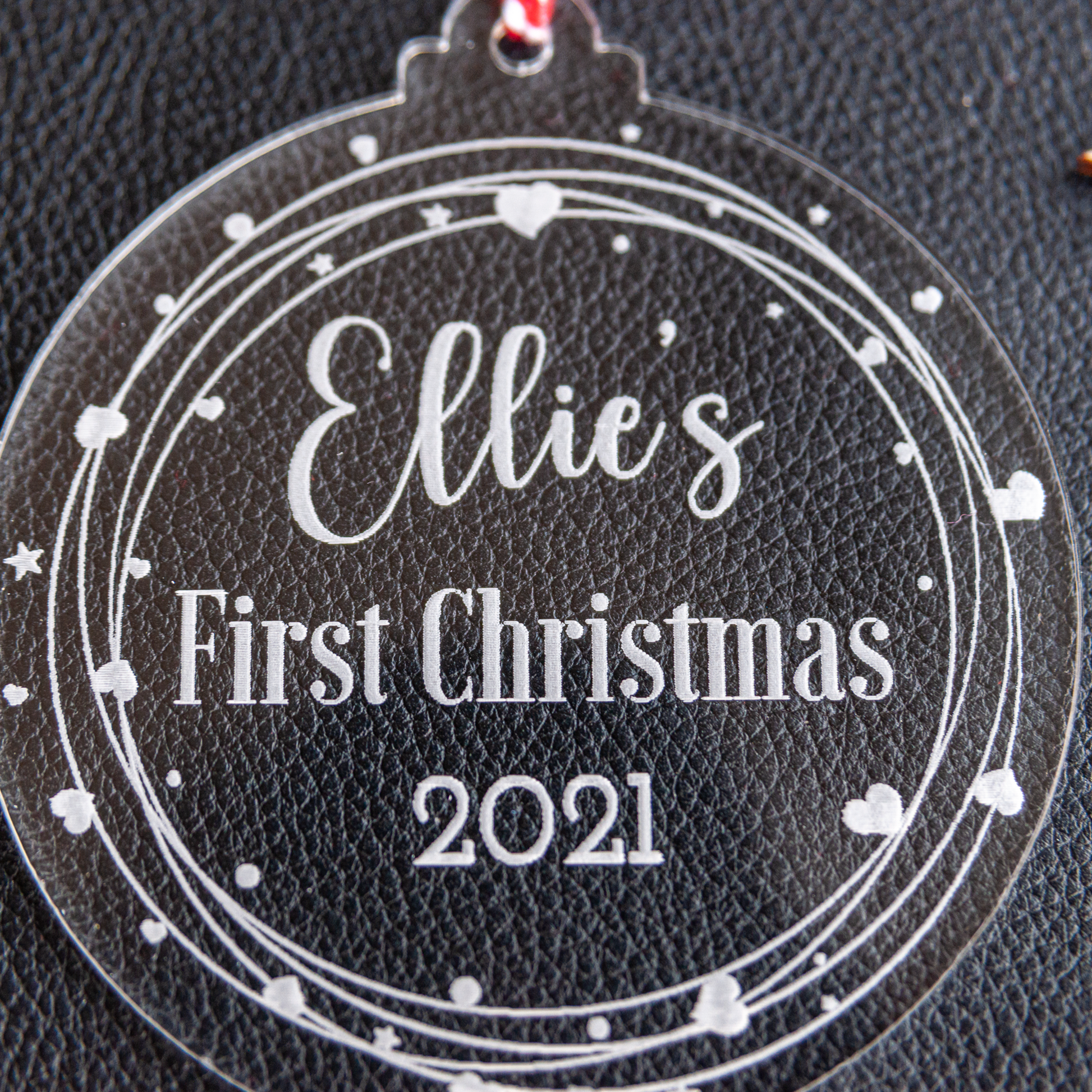 Engraved clear acrylic heart wreath bauble for baby’s first Christmas