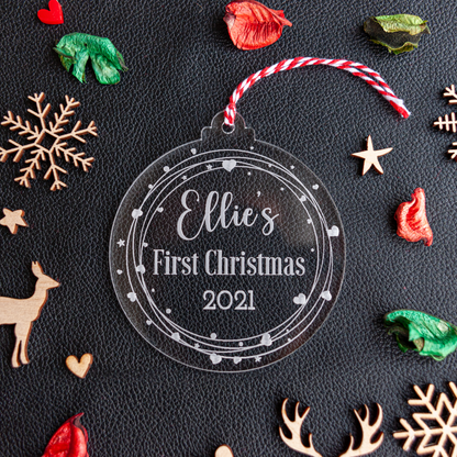 Personalised clear acrylic ‘My First Christmas’ bauble with heart wreath and baby’s name