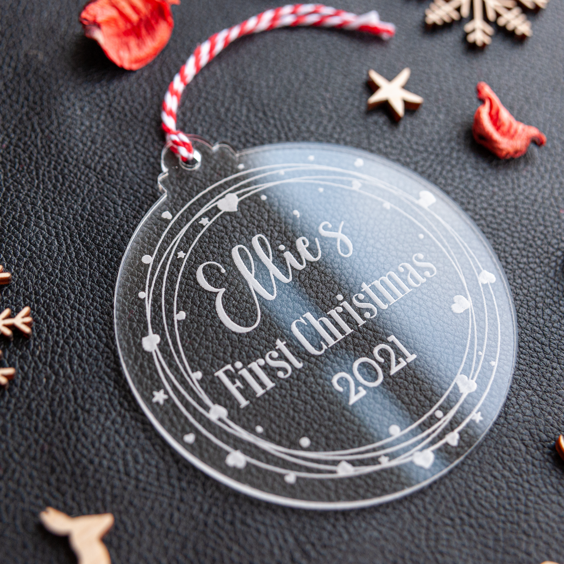 Personalised clear acrylic baby name bauble with year for first Christmas