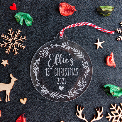 Clear acrylic bauble with red and white festive twine; engraved name and heart detail visible