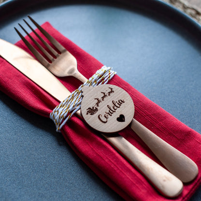 Engraved wooden name card with heart detail and Santa sleigh engraving