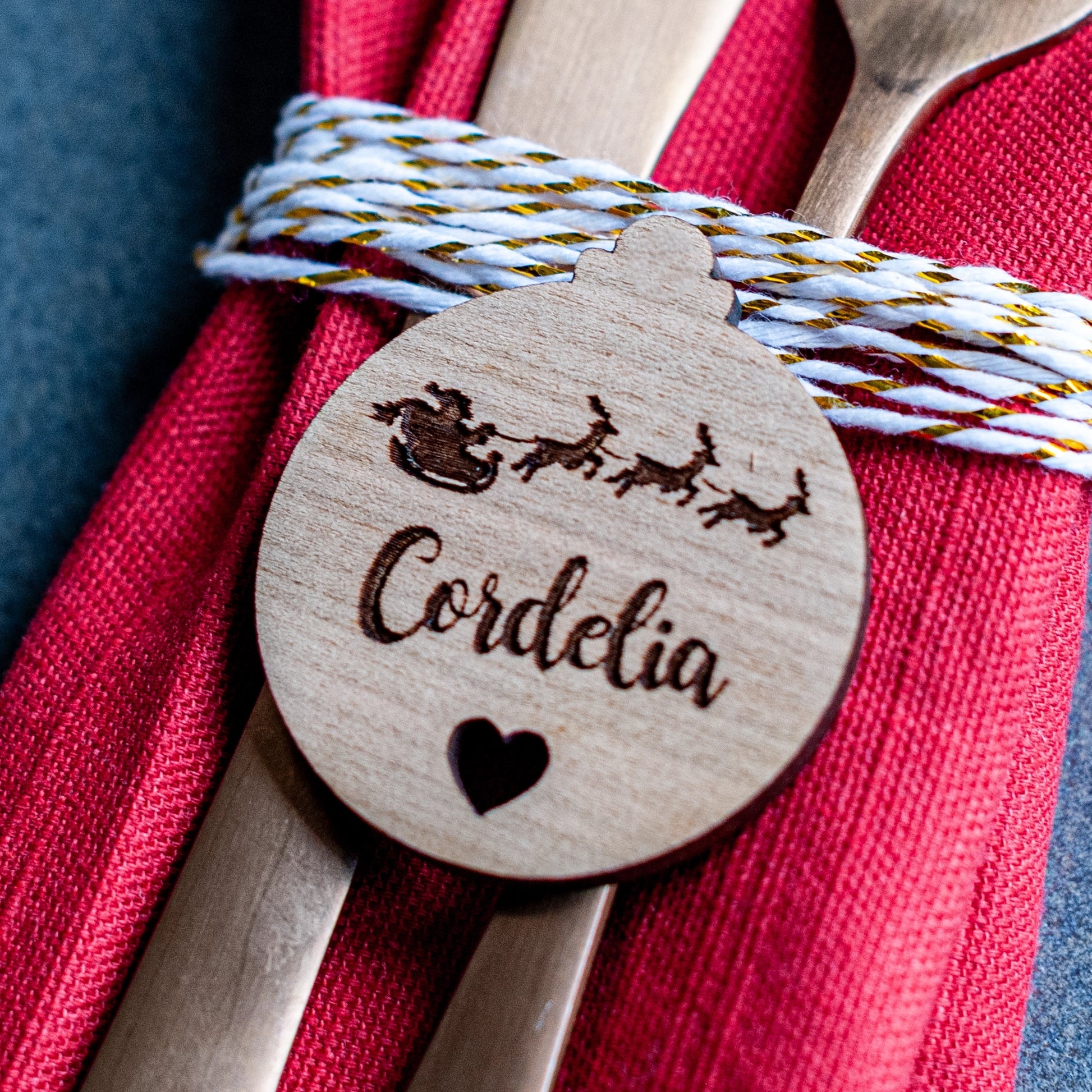 Wooden Christmas place setting engraved with name and Santa sleigh design