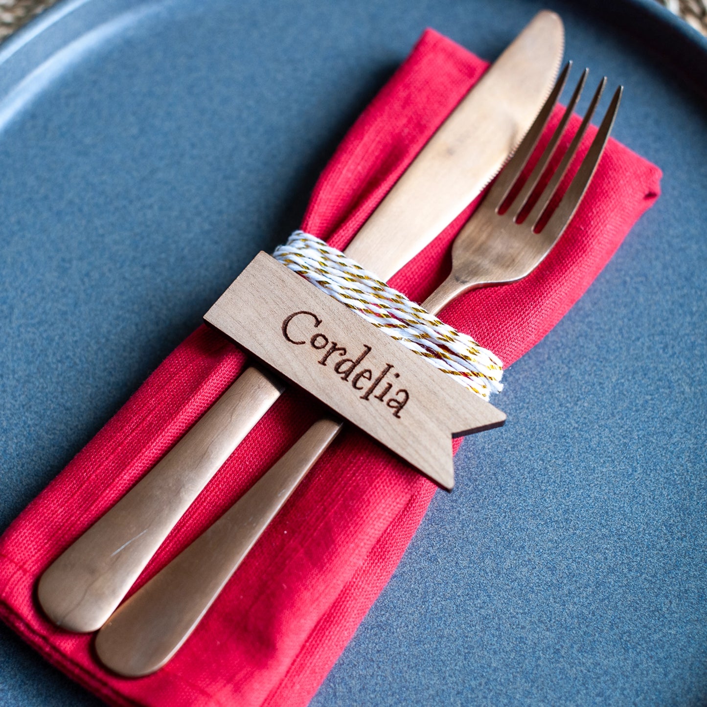 Rustic wooden name tag with engraved text for holiday dinner