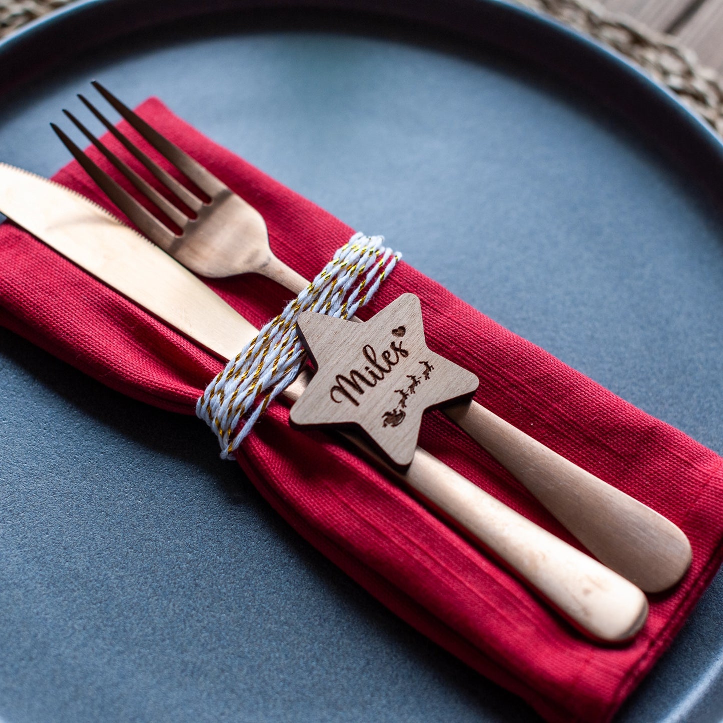 Engraved wooden Christmas name tag featuring Santa and sleigh