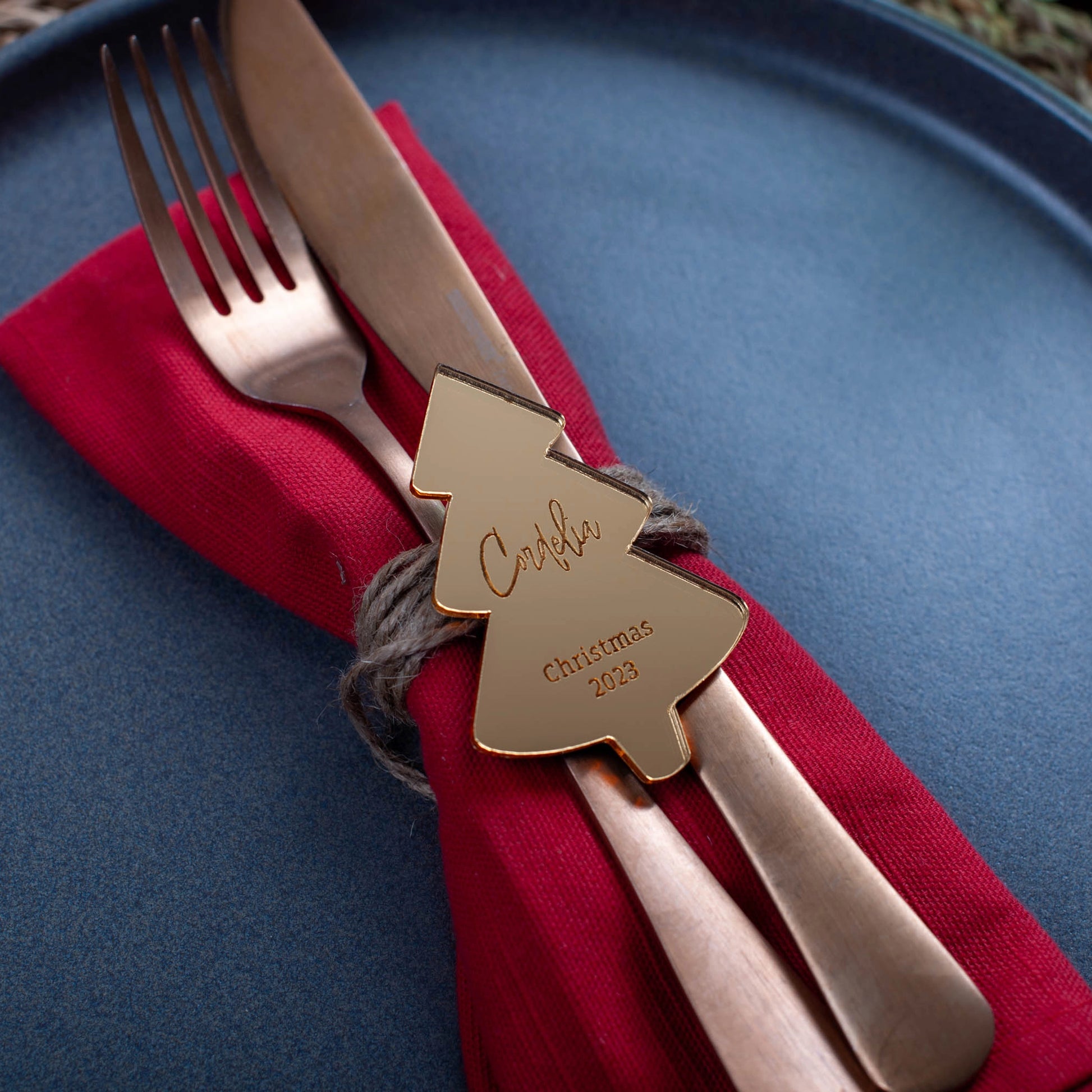 Personalised gold acrylic Christmas tree name tag on dinner plate