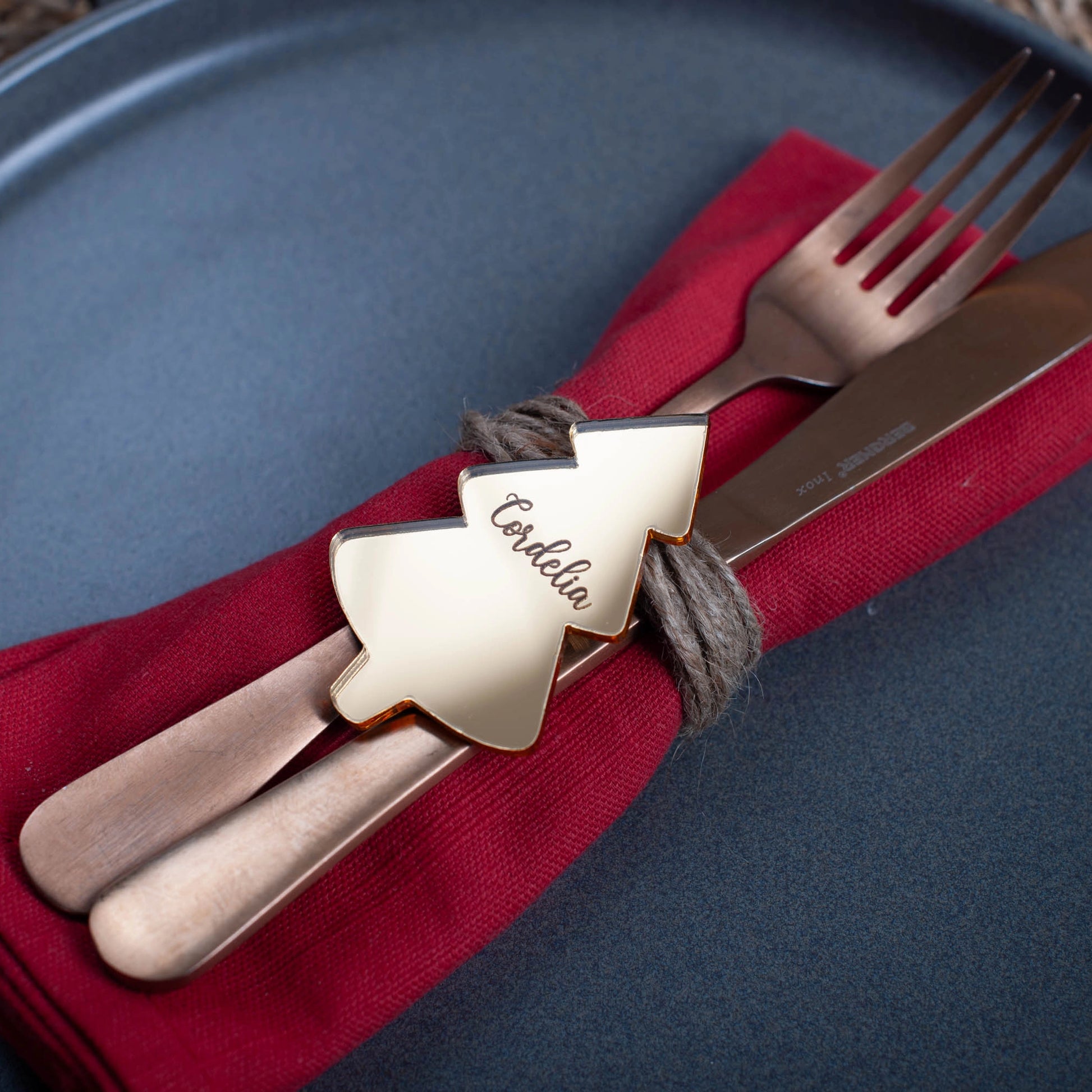 Reflective gold acrylic tree-shaped place card engraved with guest name