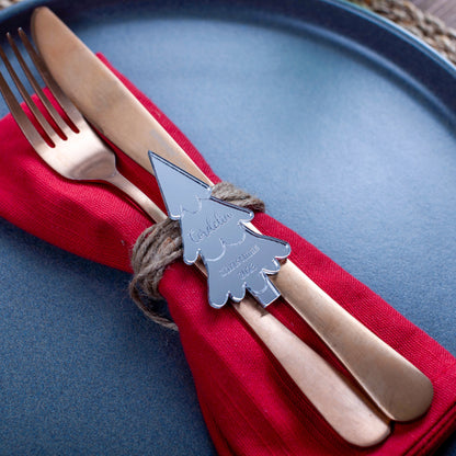 Reflective silver place setting card engraved with name and tree design