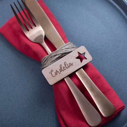 Festive wooden table name tag engraved with name and star cutouts