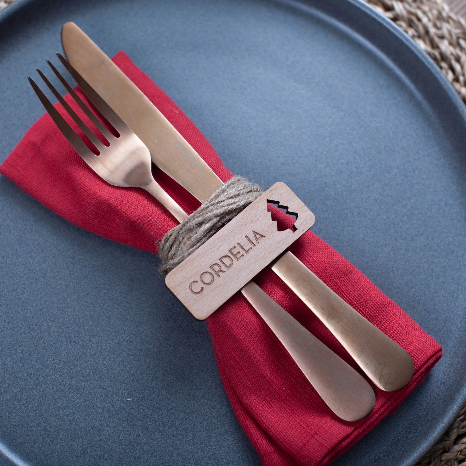 Sustainable engraved wooden Christmas table label with ornament design