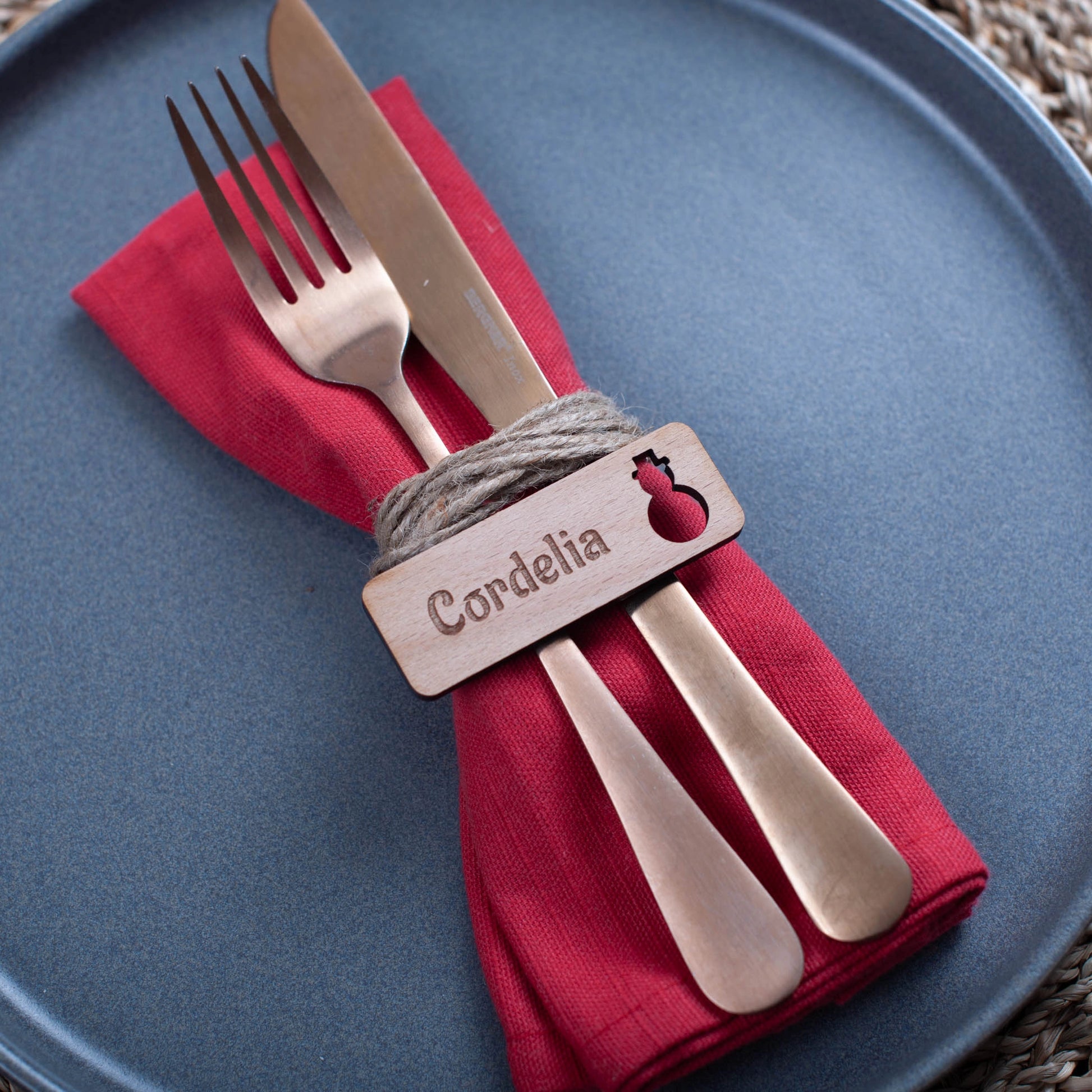 Rustic engraved wooden place card with Christmas ornament details snowman cutout