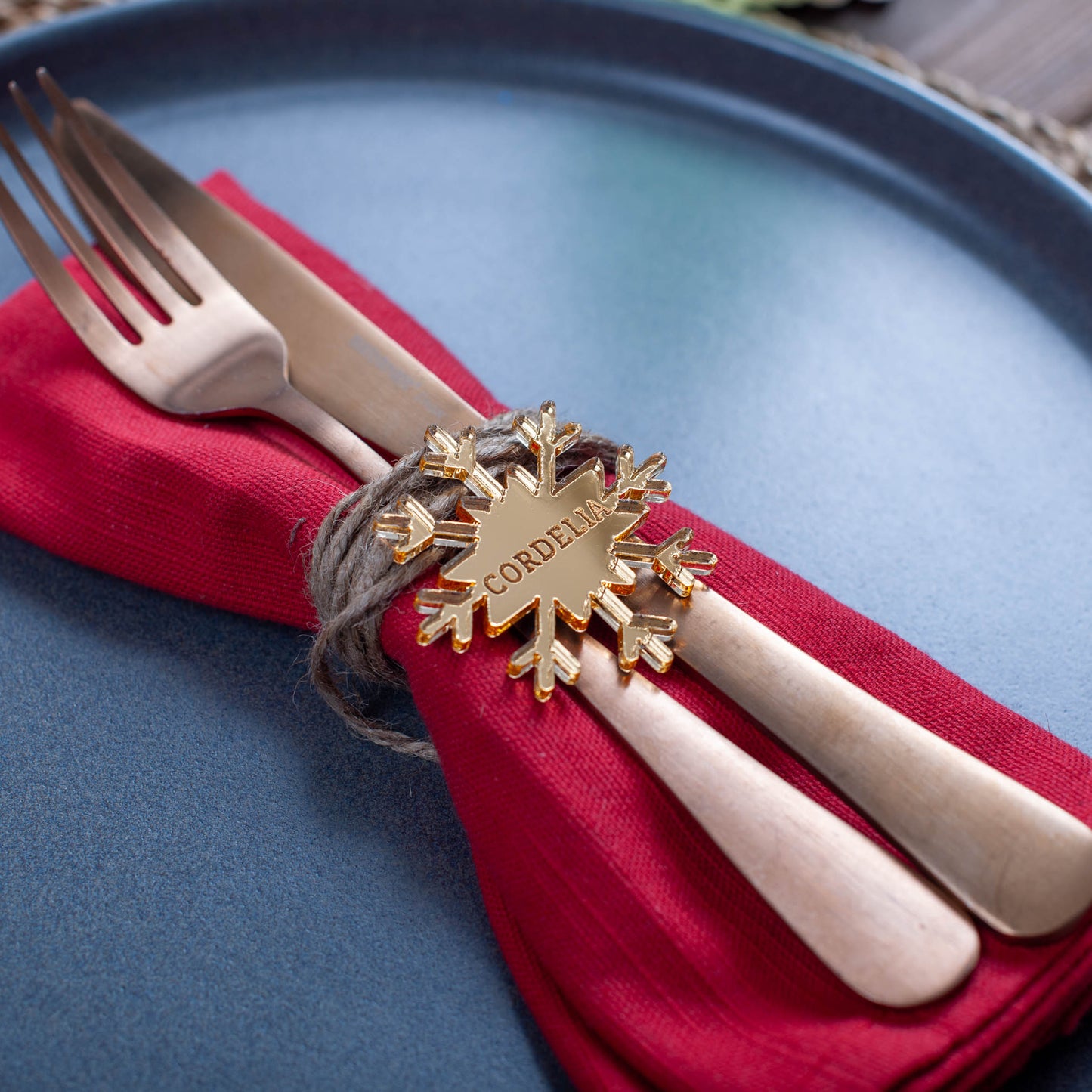 Laser-cut acrylic snowflake place card with engraved name