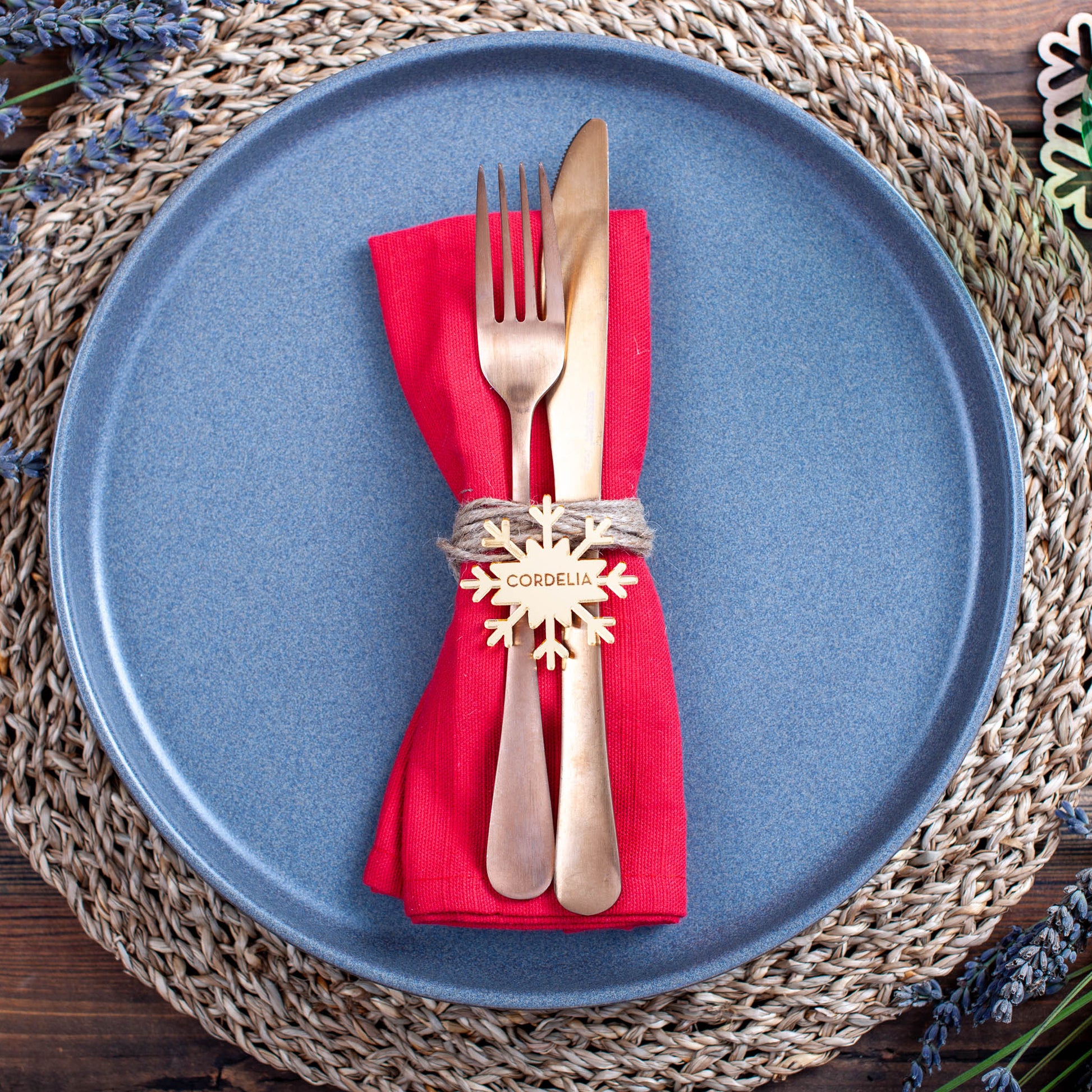 Modern dining table styled with engraved snowflake name tags