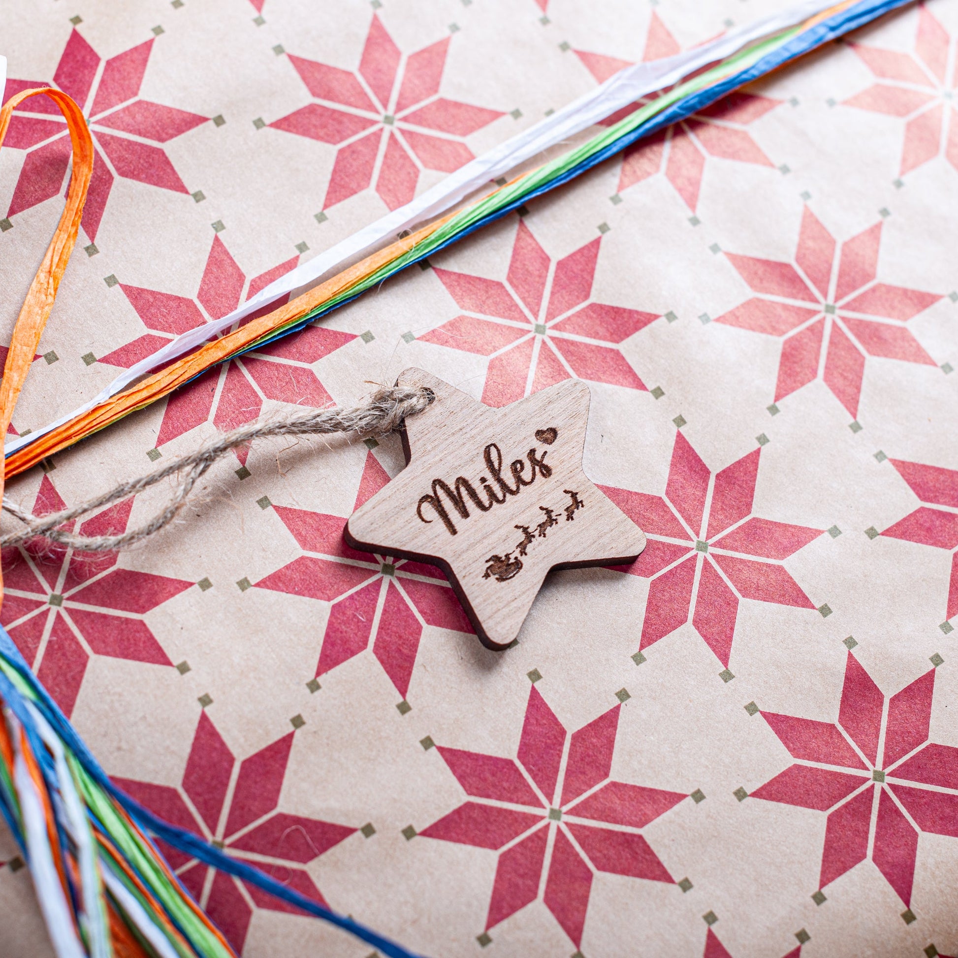 Engraved wooden star gift tag for festive Christmas wrapping décor