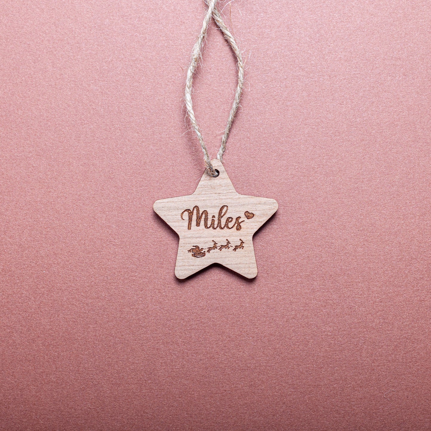 Custom wooden star ornament used as Christmas gift label