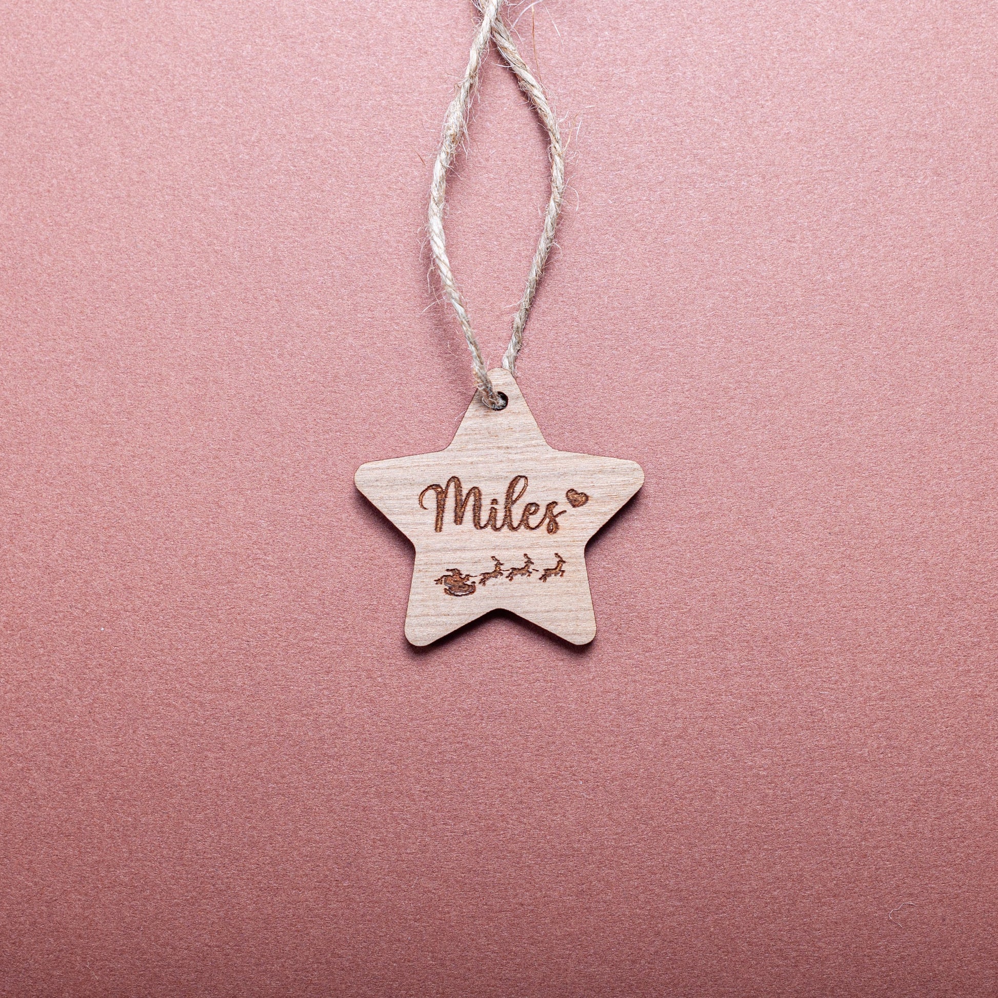 Custom wooden star ornament used as Christmas gift label