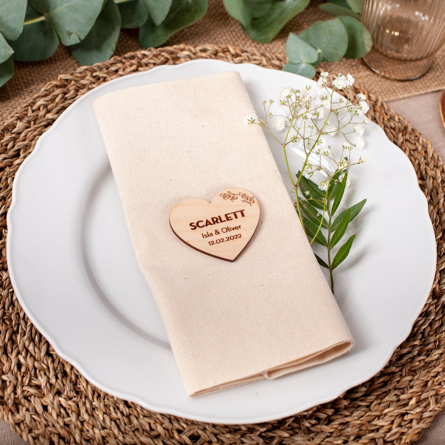 Personalised wooden heart place card engraved with guest name for wedding table setting