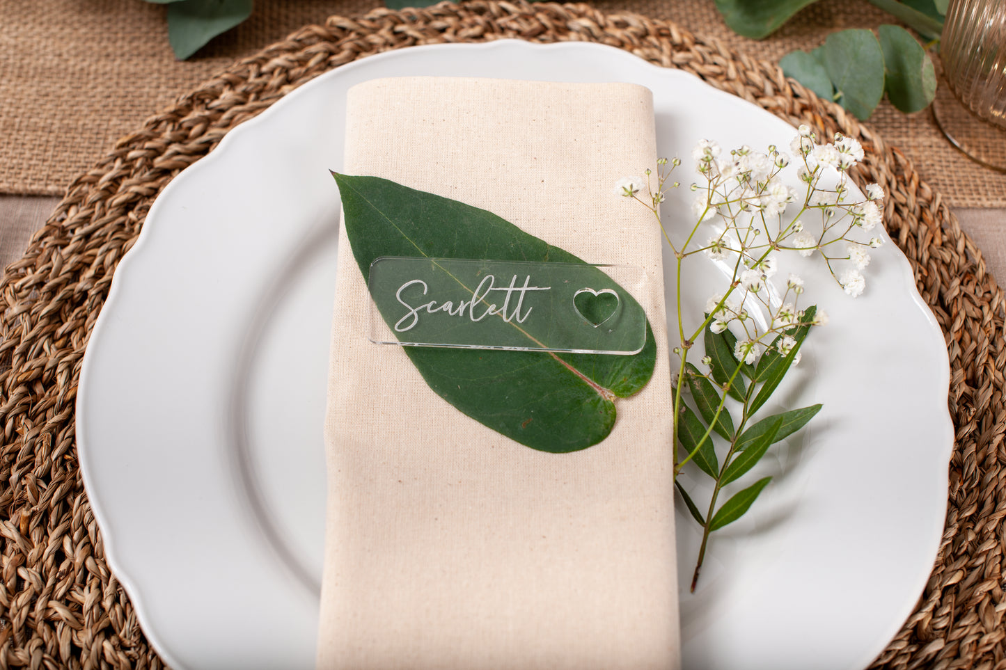 Acrylic wedding name place cards with heart cut-out detail