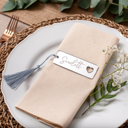 Close-up of personalised mirror acrylic wedding name tags