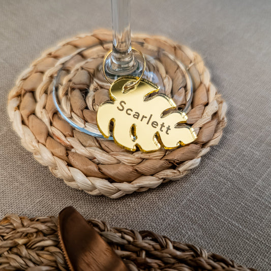 Personalised monstera leaf place card engraved with guest name for wedding