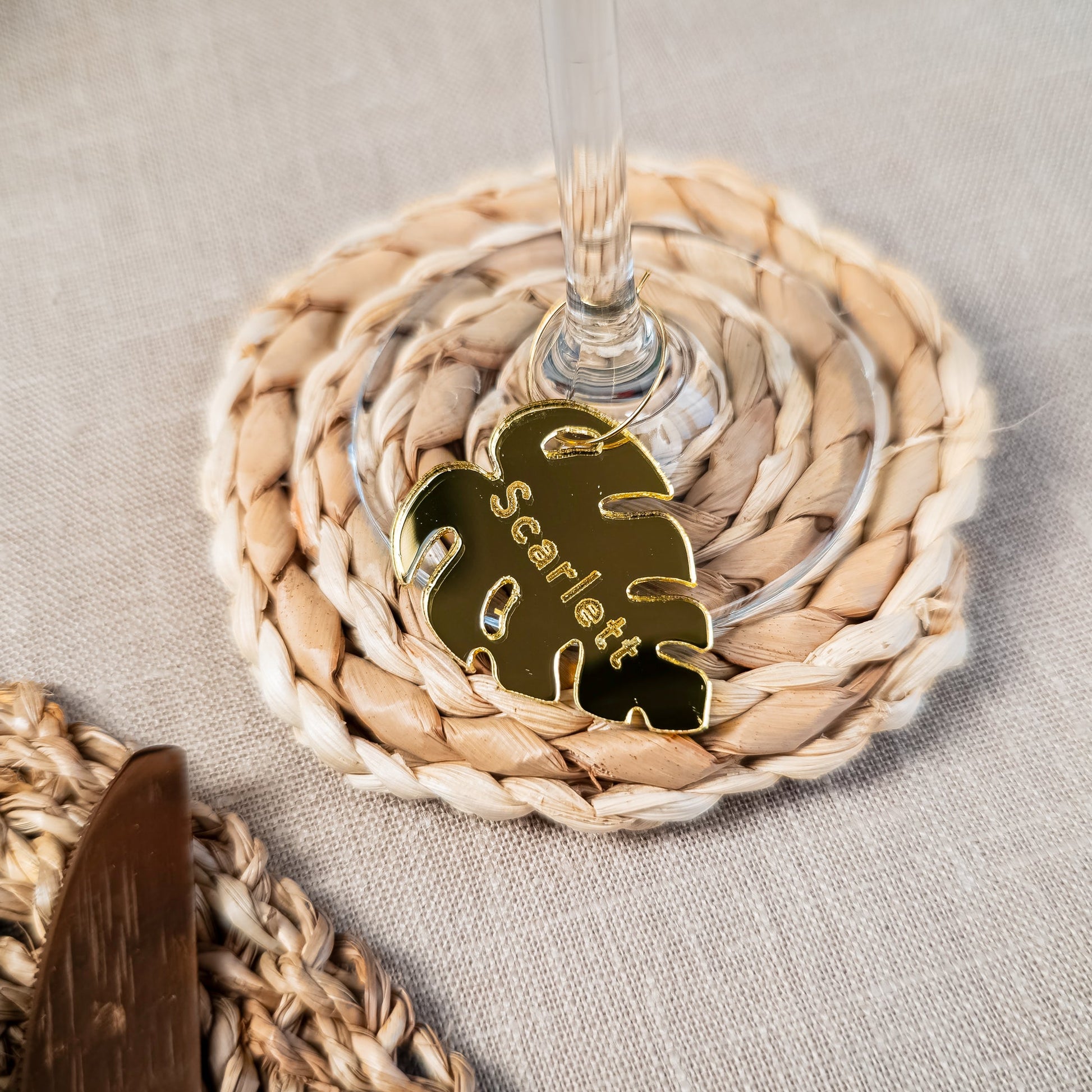 Tropical monstera leaf name tag for wedding table and drink setting