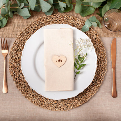 Personalised wood place card displayed on wedding reception table