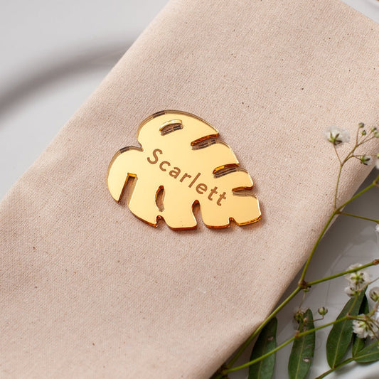 Engraved gold mirrored acrylic name place for tropical wedding decor