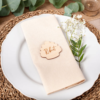 Personalised wooden seashell place card engraved with guest name for beach wedding