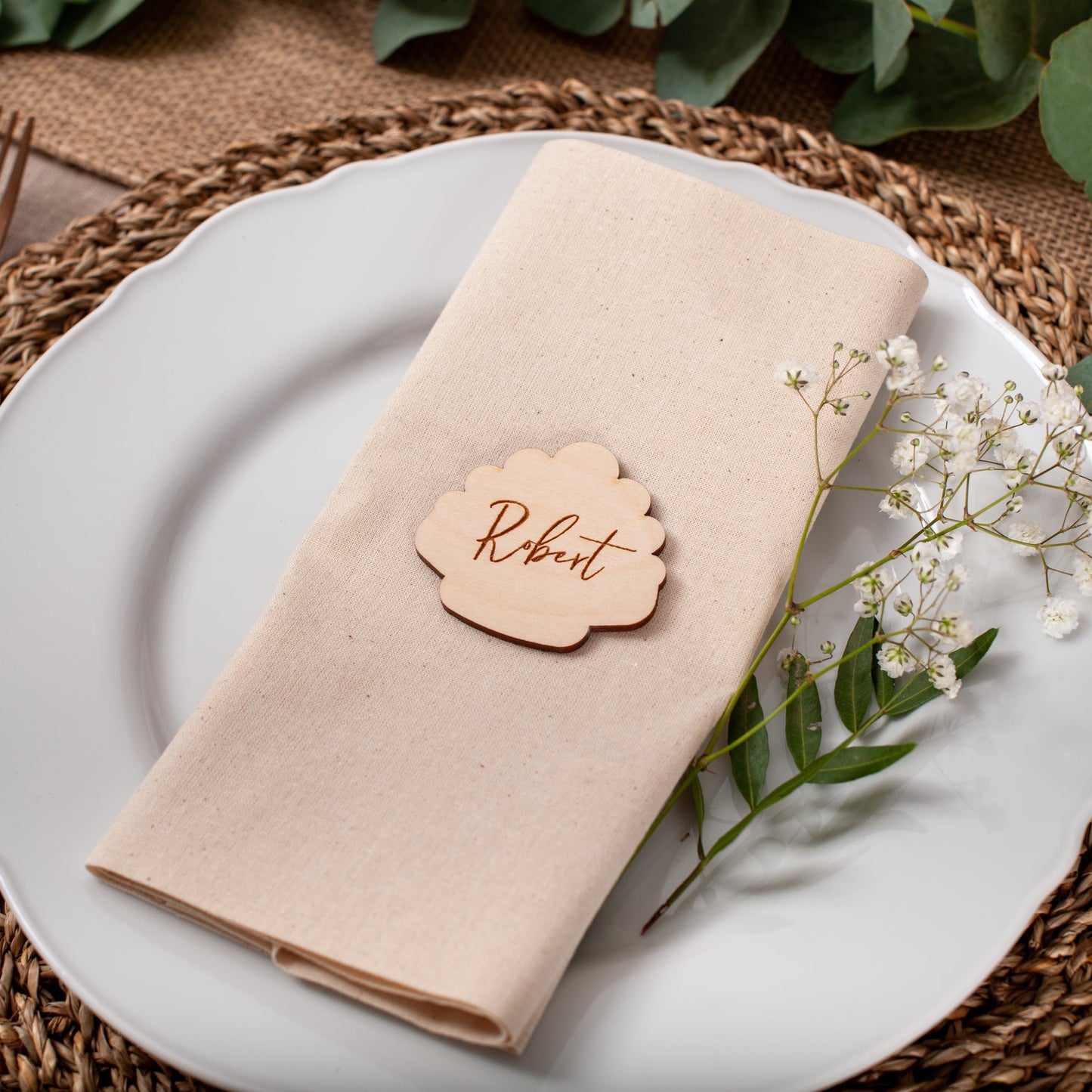 Laser cut wooden seashell place card used for coastal wedding table setting