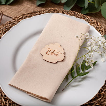 Laser cut wooden seashell place card used for coastal wedding table setting