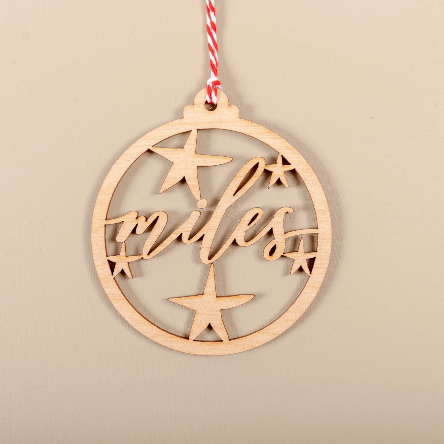 Personalised wooden cutout name Christmas bauble hanging on tree