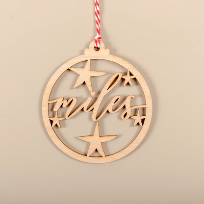 Personalised wooden cutout name Christmas bauble hanging on tree
