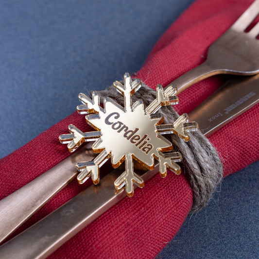 Minimalist personalised snowflake name tag on festive table