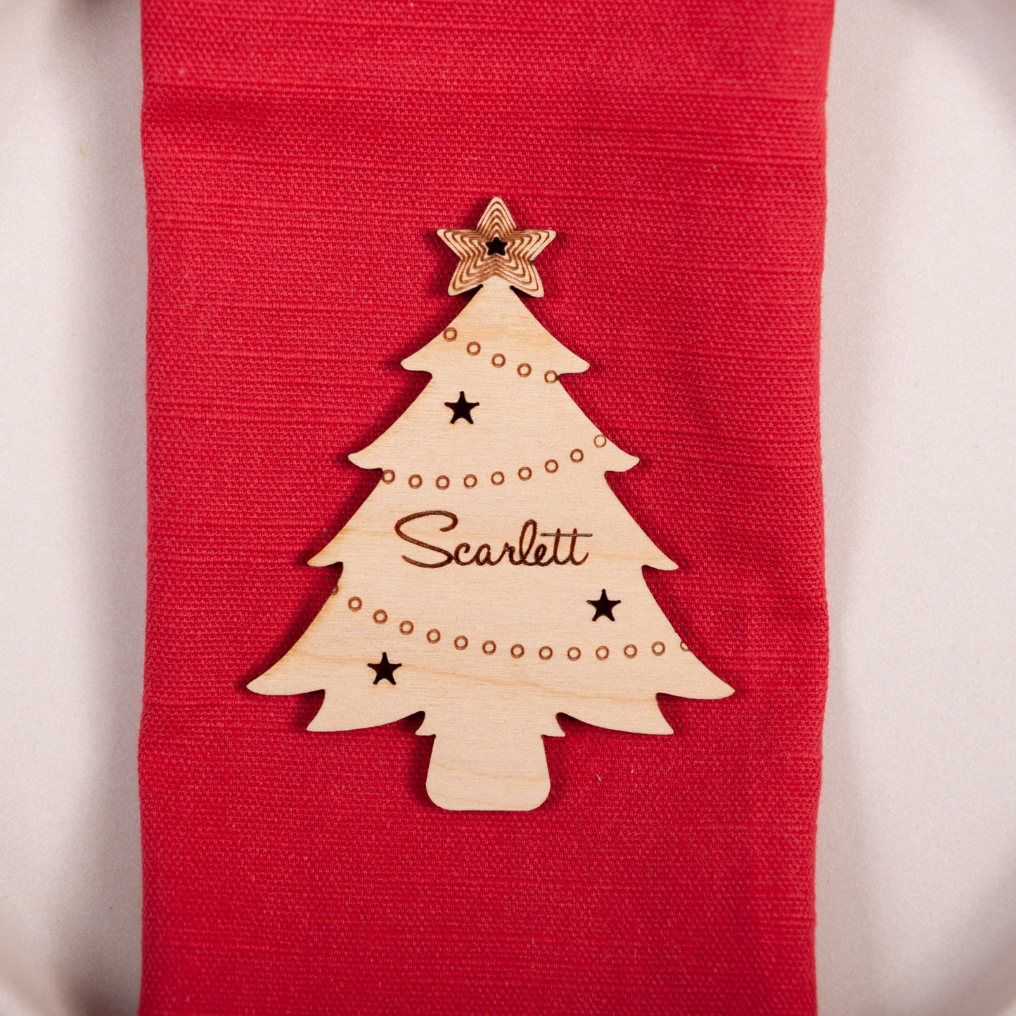 Engraved wooden Christmas tree name tag for holiday hosting table setting