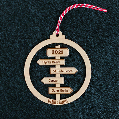 Personalised travel sign post Christmas bauble with couple names and destinations