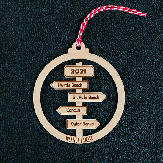 Personalised travel sign post Christmas bauble with couple names and destinations
