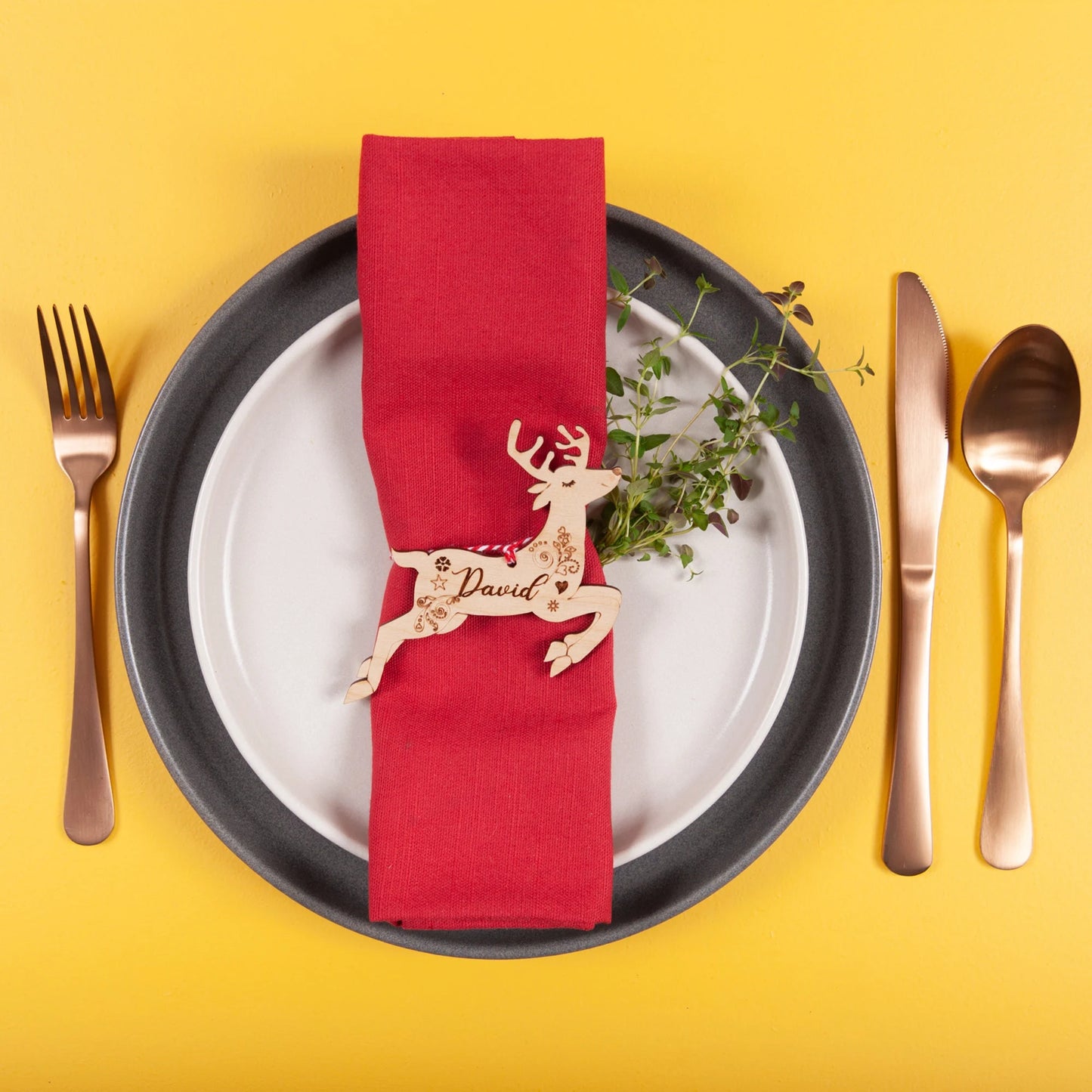 Laser cut reindeer name tag in gold acrylic for festive hosting table