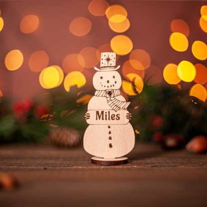 Custom snowman wooden decoration used as Christmas table place card